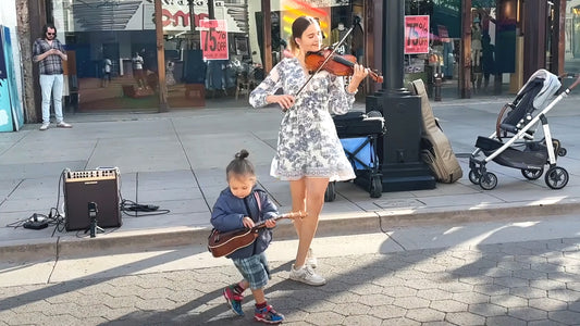 Violin prodigy plays Beatles classic and toddler steals show